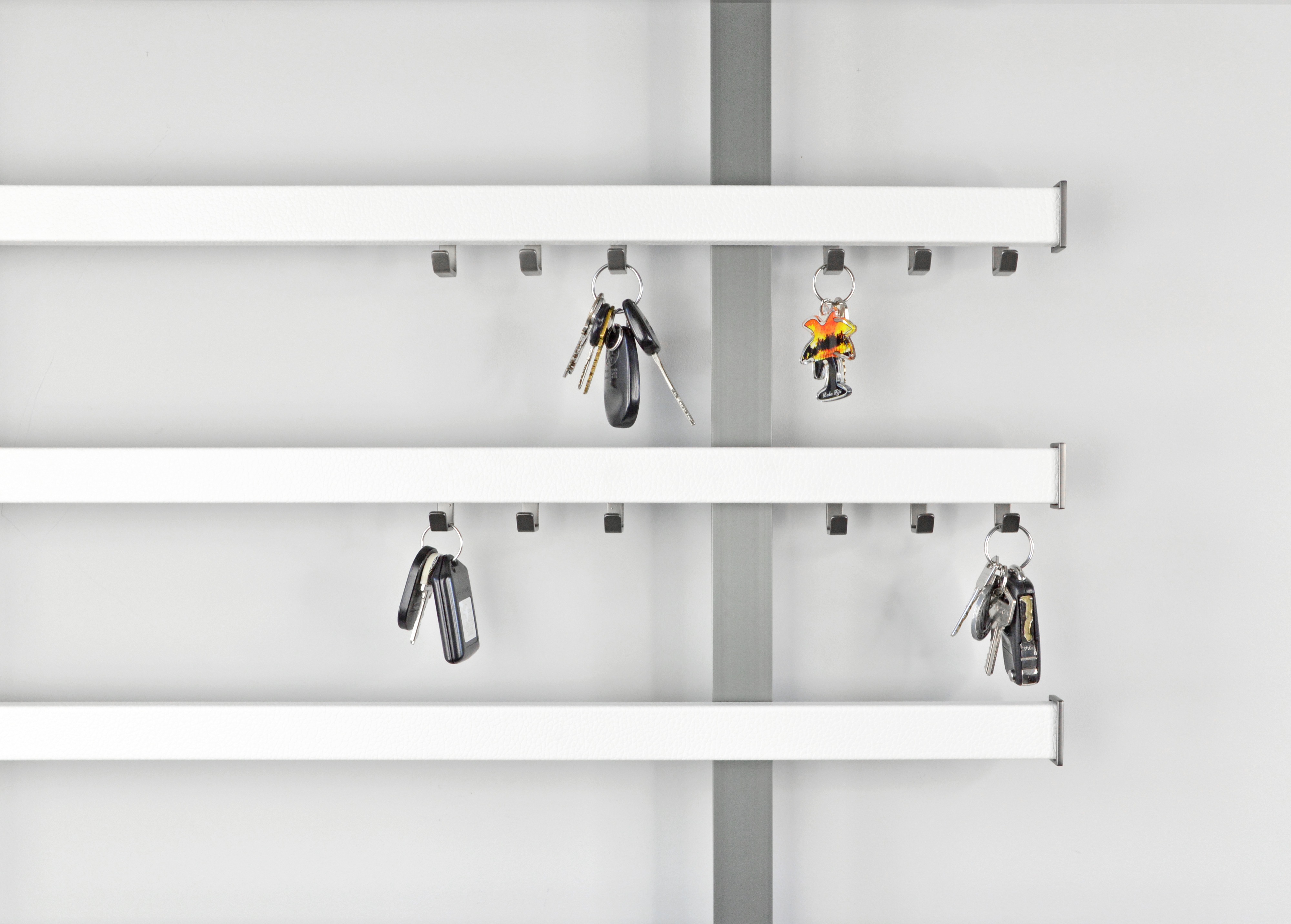 StoreWALL accessory hooks mounted on a garage panel system
