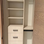 Arctic reach-in closet with flat drawer fronts and black hardware. Snowmass Village, CO