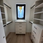 Arctic walk-in closet with modern drawer fronts and black hardware. Carbondale, CO